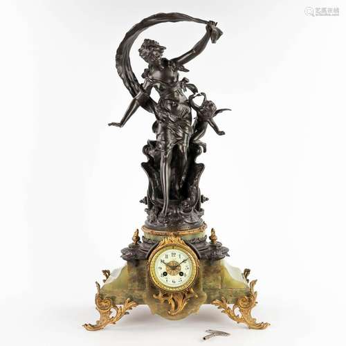 Auguste MOREAU (1834-1917) A mantle clock, spelter on green ...