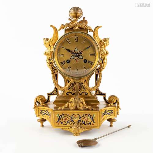A small mantle clock, bronze decorated with enamel, angels a...