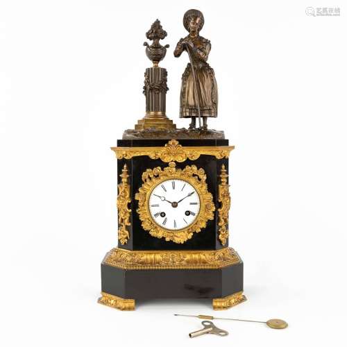 A black marble and bronze mantle clock 'Lady with a rake' 19...