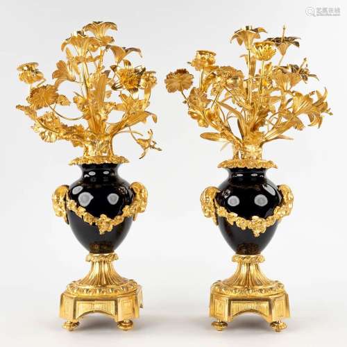 A pair of candelabra, gilt bronze on porcelain and decorated...