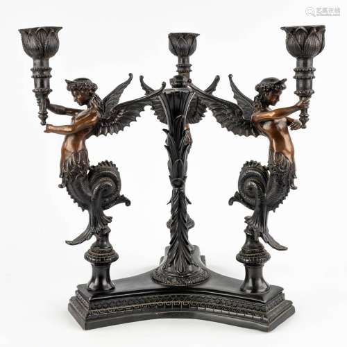 A large table candelabra decorated with three 'Mélusines', p...