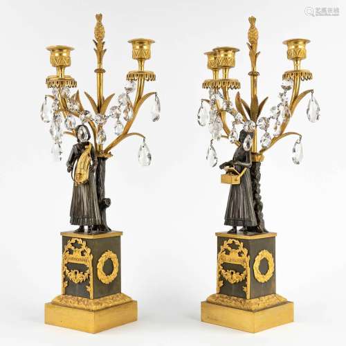 A pair of candelabra, gilt and patinated bronze, Empire, 19t...