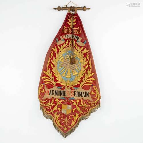 An antique banner, 'Harmonie Saint Germain, Couvin', and use...