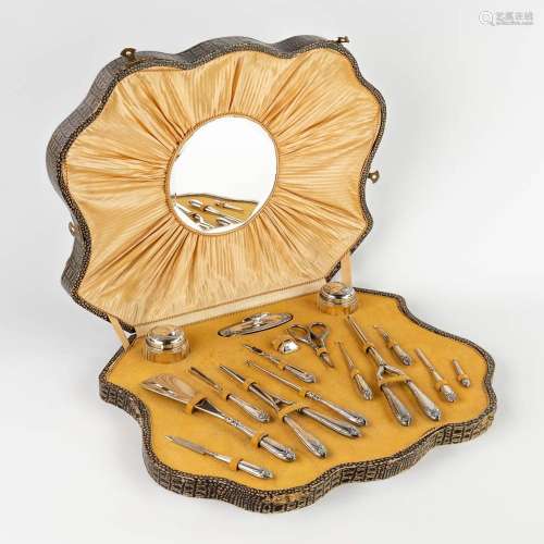 An antique manicure set, silver, mounted in a box. Circa 190...