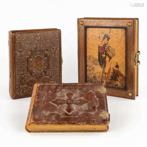 Three decorative photo books, leahter and marquetry covers. ...