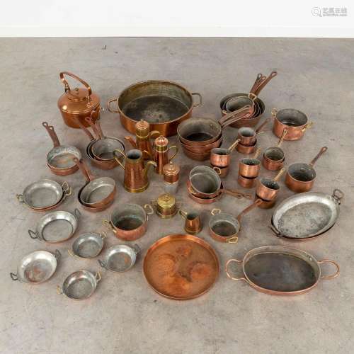 A large collection of copper pots and pans. Approximately 40...
