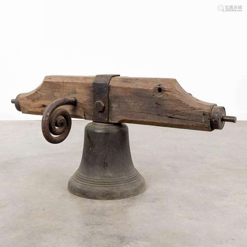 An antique bronze bell mounted on a wood base. 18th C. (W:12...