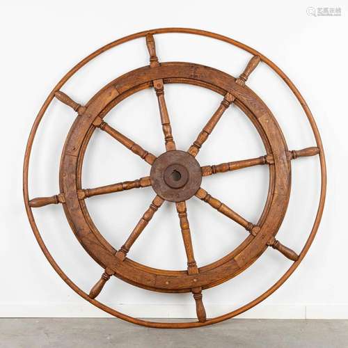 A large ship's steering wheel, made of wood. (D:151 cm)