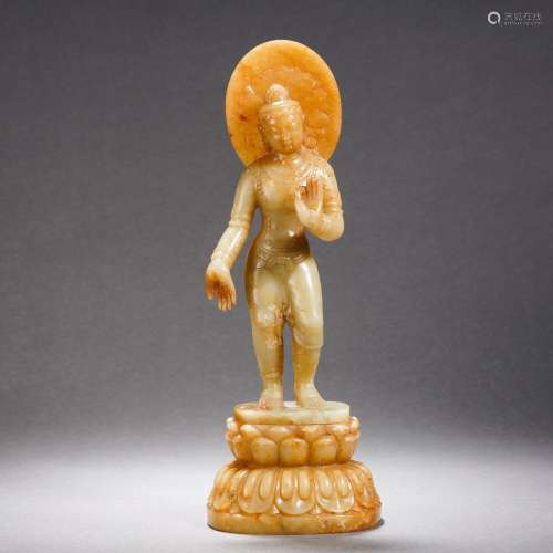 A Carved Jade Standing Buddha