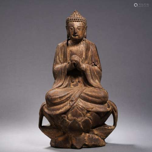 A Carved Wooden Seated Buddha