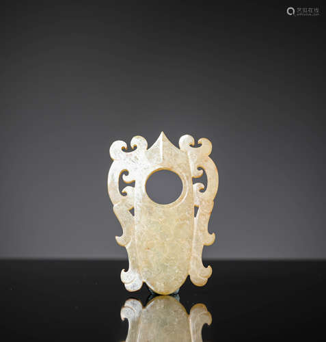 A Carved Jade Almond Pendant