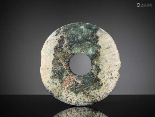 A Celadon Jade Annular Bi