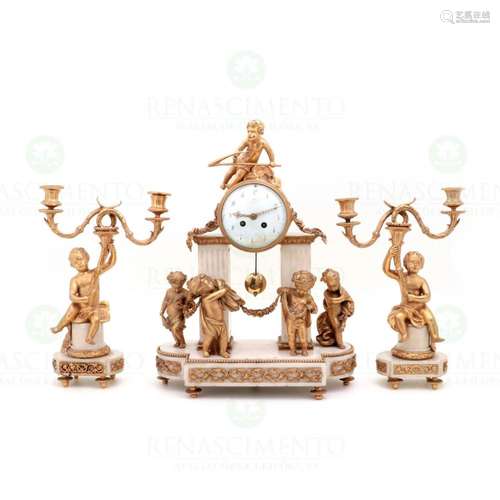 A LOUIS XVI STYLE CLOCK AND PAIR OF CANDELABRA