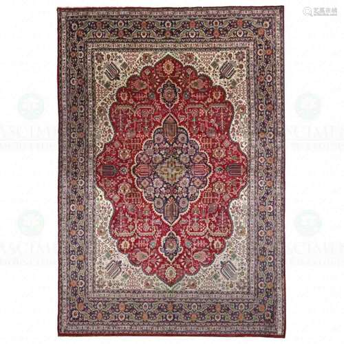 AN ORIENTAL CARPET