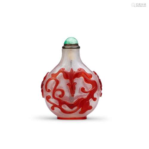 A RED OVERLAY GLASS 'DRAGONS AND BATS' SNUFF BOTTLE Imperial...