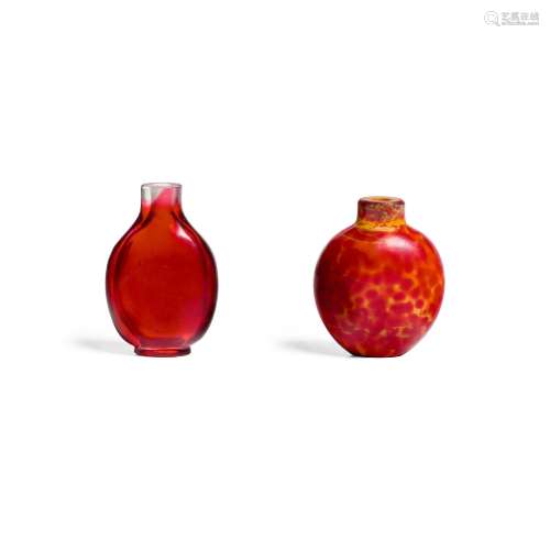 TWO GLASS SNUFF BOTTLES, ONE REALGAR, ONE TRANSPARENT RED OV...