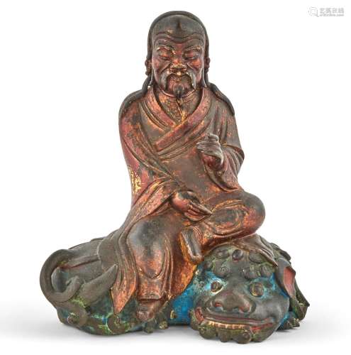 A Chinese Polychromed and Gilt Lacquered Bronze Seated Figur...
