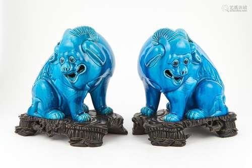 A Pair of Chinese Turquoise Glazed Porcelain Horned Sheep Fi...