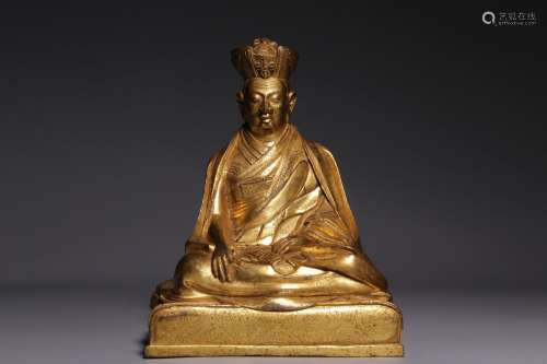 A gilt-bronze seated figure of Karma Pakshi, Qing Dynasty