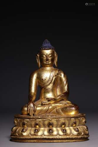 A gilt-bronze seated figure of Shakyamuni, Qing Dynasty