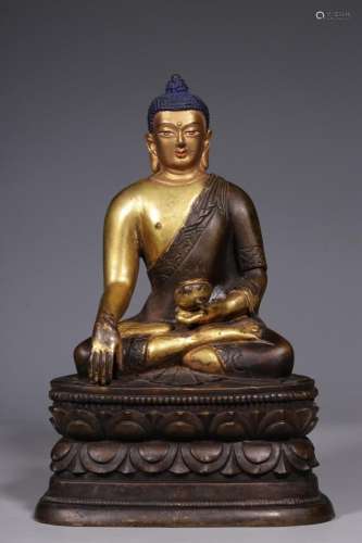 A gilt-bronze seated figure of Shakyamuni, Qing Dynasty