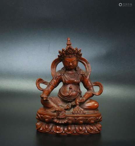 Tibetan Carved Boxwood Seated Jambhala Figure