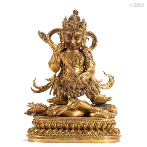 A RARE TIBETAN BRONZE-GILT GUARDIAN