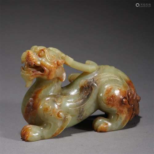 A CHINESE CARVED JADE MYTHICAL BEAST