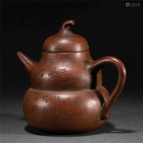 A CHINESE INSCRIBED YIXING-GLAZE TEAPOT