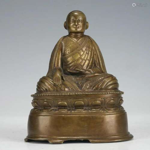 A TIBETAN BRONZE LAMA