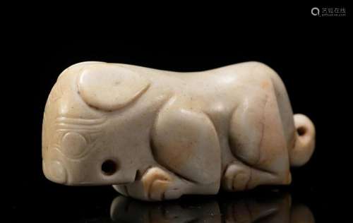 A CHINESE CARVED JADE MYTHICAL BEAST