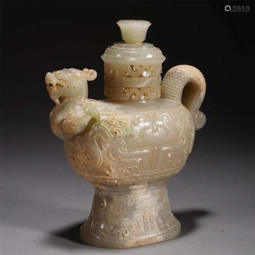 A CHINESE ARCHAIC CARVED JADE EWER