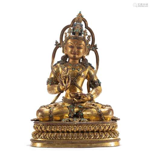 A SINO-TIBETAN BRONZE-GILT DEITY