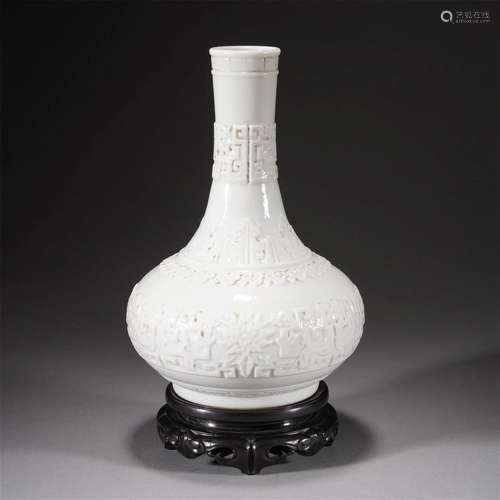 A CHINESE CARVED PORCELAIN BOTTLE VASE