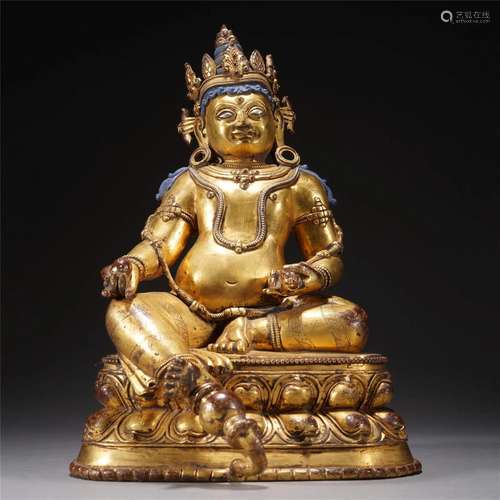 A TIBETAN BRONZE-GILT JAMBHALA