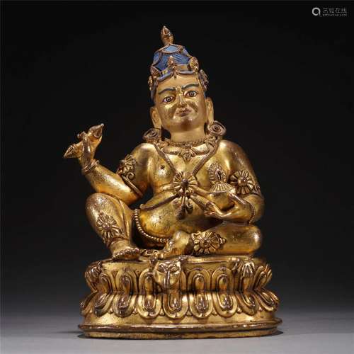 A TIBETAN BRONZE-GILT SIDDHA