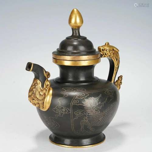 A CHINESE BRONZE DRAGON KETTLE