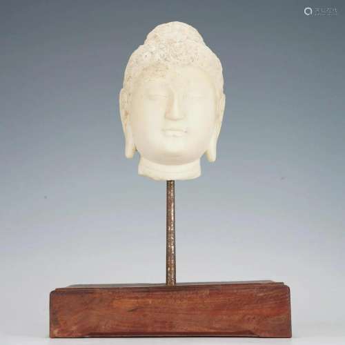 A CHINESE CARVED MARBLE BODHISATTVA HEAD