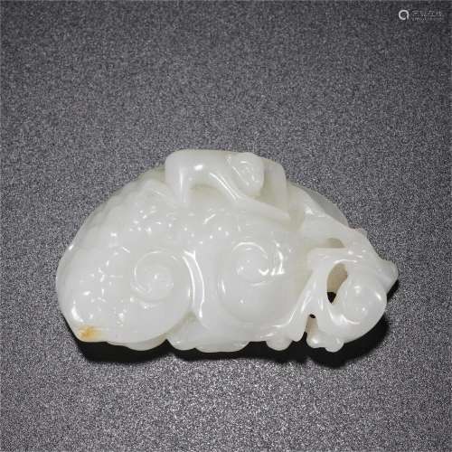 A CHINESE CARVED WHITE JADE PAPER WEIGHT