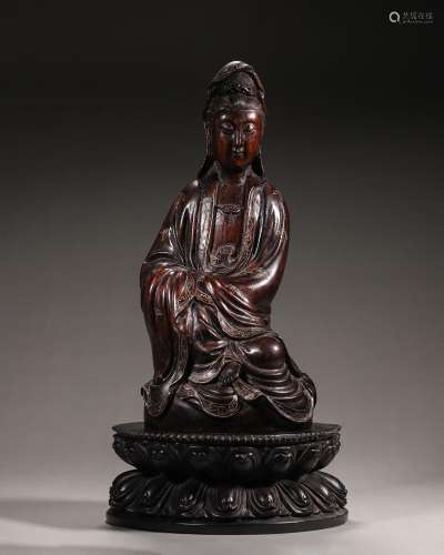 A red sandalwood Guanyin statue