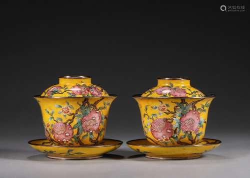A pair of pomegranate patterned copper enamel covered bowls,...