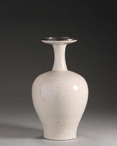 A flower carved Ding kiln porcelain vase