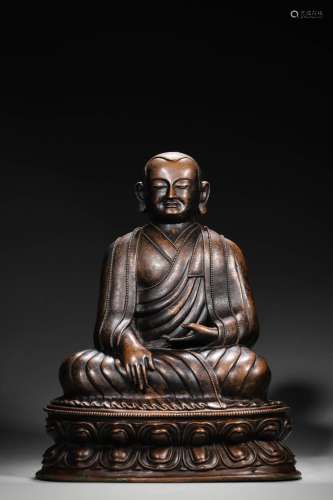 A copper buddha statue