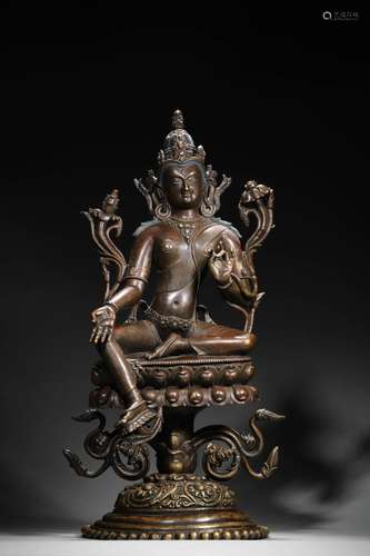 A silver-inlaid copper green tara statue