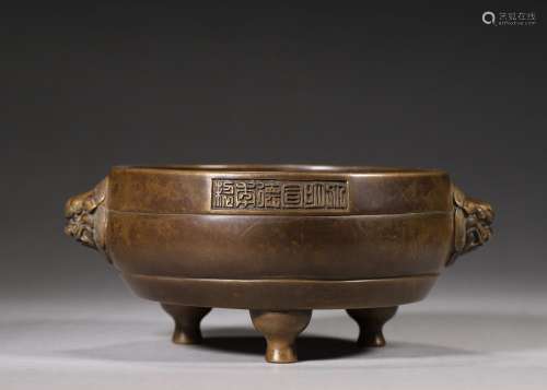 A copper censer with lion shaped ears, Xuande period, Ming d...
