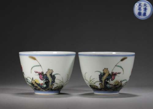 A pair of famille rose flower and butterfly porcelain cups, ...