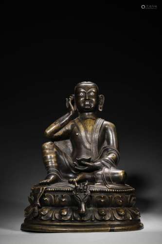 A silver-inlaid copper buddha statue