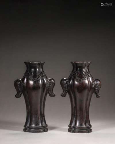 A pair of ruyi patterned red sandalwood vases with elephant ...