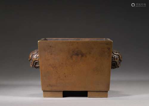 A squared copper censer with beast shaped ears
