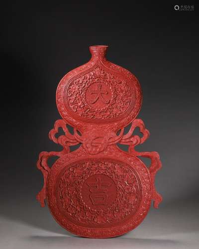 A carved red lacquer gourd-shaped vase, Qianlong period, Qin...